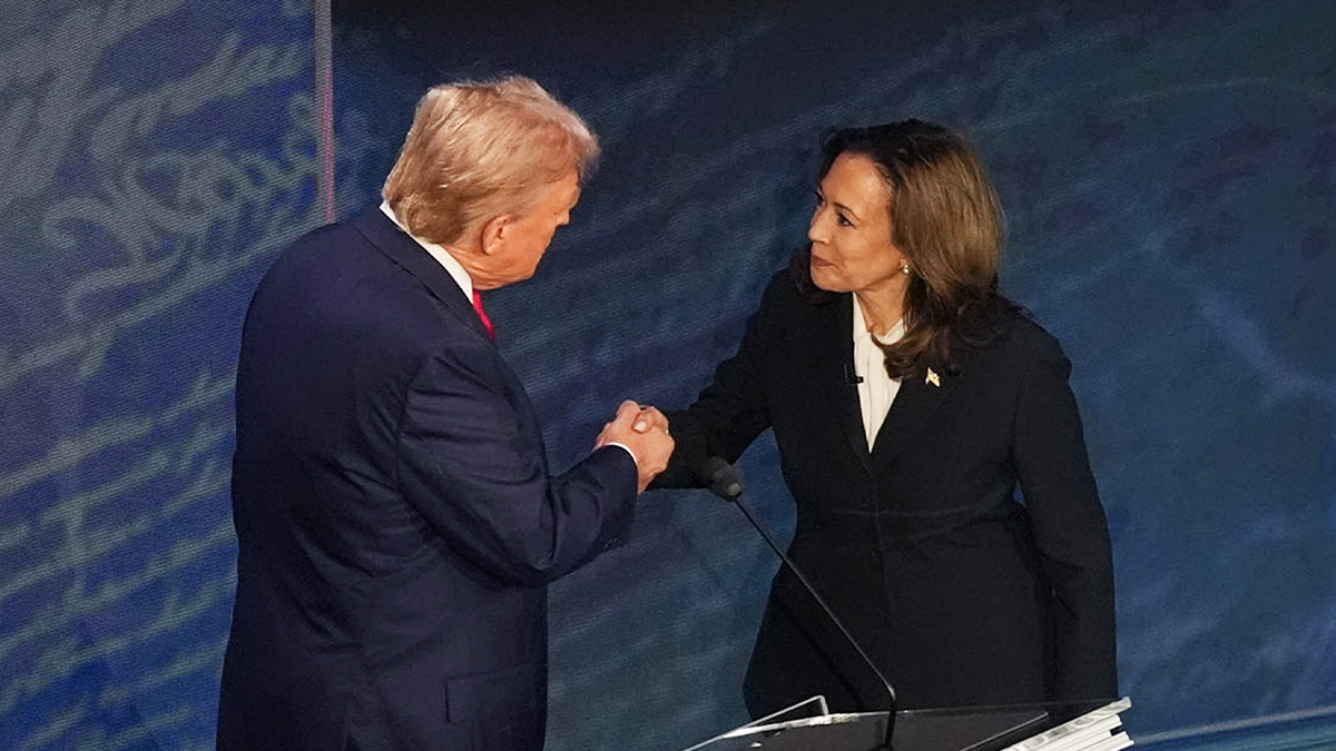 Donald Trump and Kamala Harris shake hands during 2024 debate