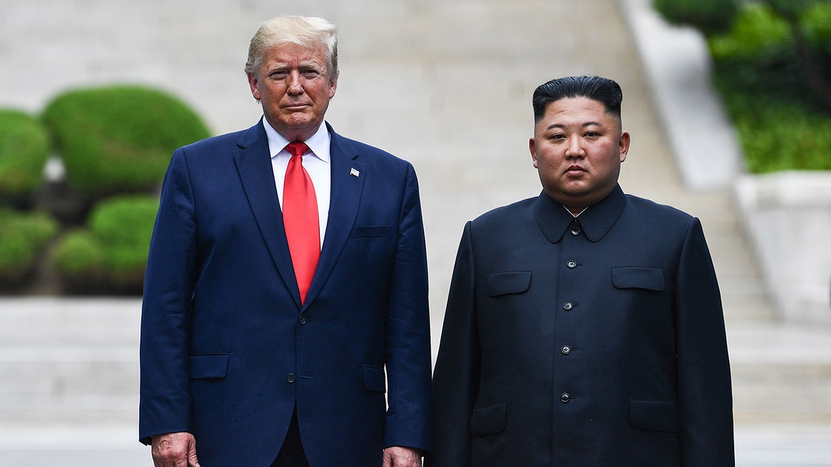 President Trump poses with Kim Jong Un