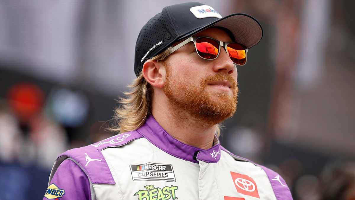 Tyler Reddick looks on during pre-race