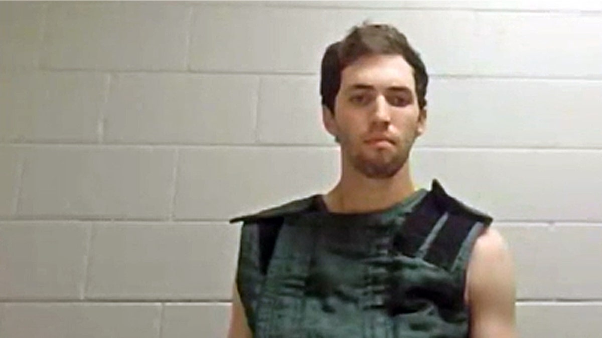 Tyler Robinson actually appeared in a prison wearing a green vest in Utah prison designed to prevent self-harm