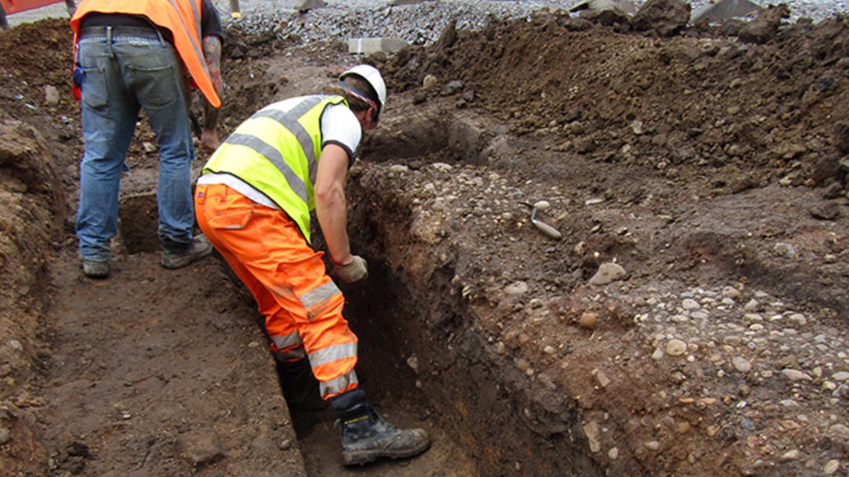Excavator digging beneath market square