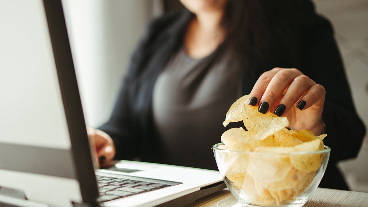 Woman eating junk food