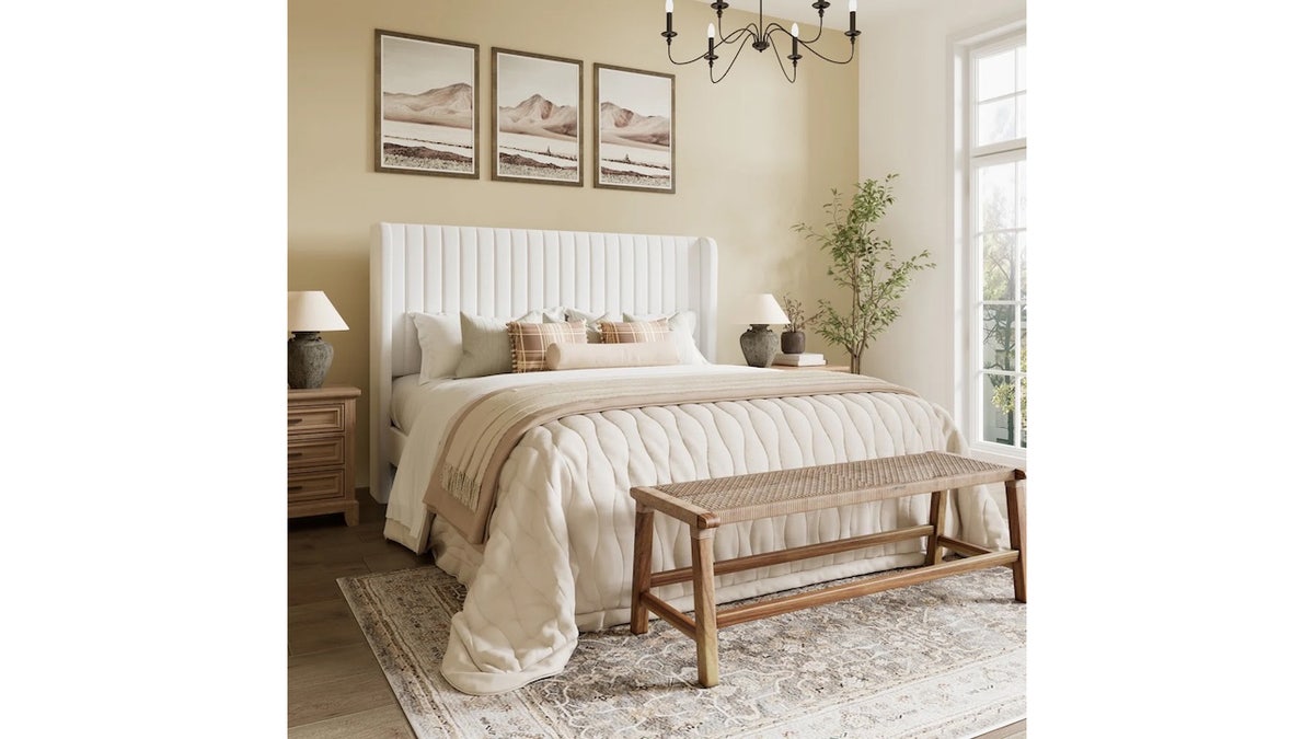 This upholstered bed will elevate the guestroom. 
