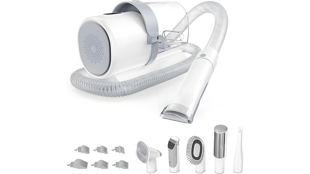 This grooming kit trims with quiet blades while a built-in vacuum collects loose fur into a dust cup.