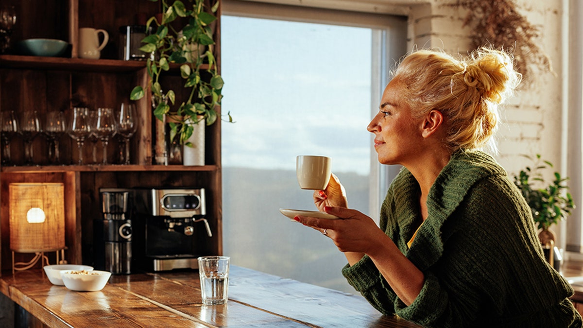 woman having coffee at home