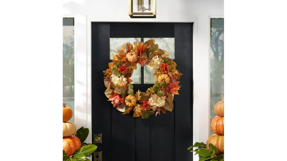 This wreath features realistic-looking hydrangeas and leaves.