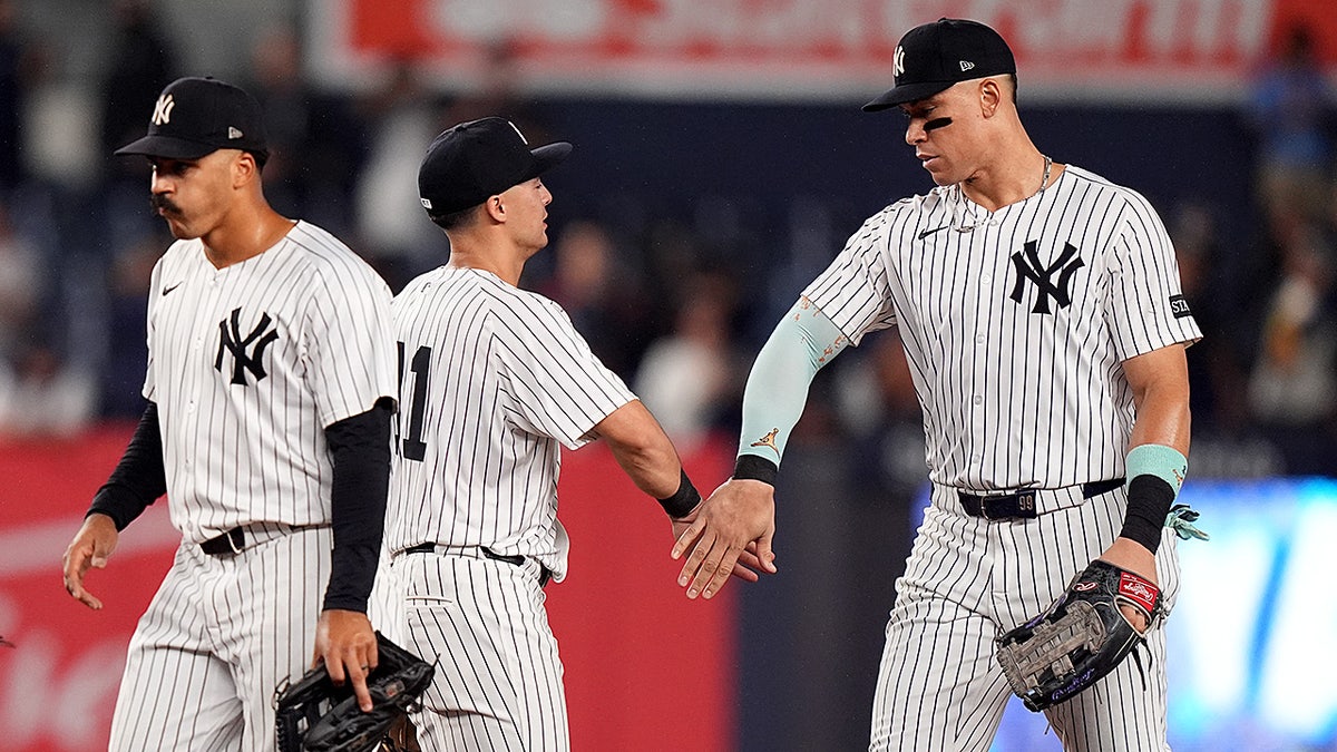 Aaron Judge and Anthony Volpe celebrate