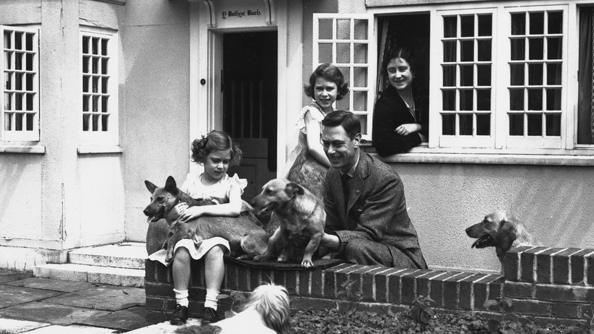 Young Princess Elizabeth outside Windsor Castle with her family.