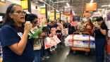 Protesters demonstrate inside of a Home Depot.
