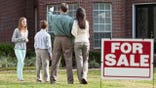 Family looks at house for sale
