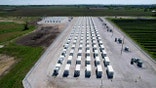 Aerial image showing long rows of battery storage units at Wisconsin’s solar project.