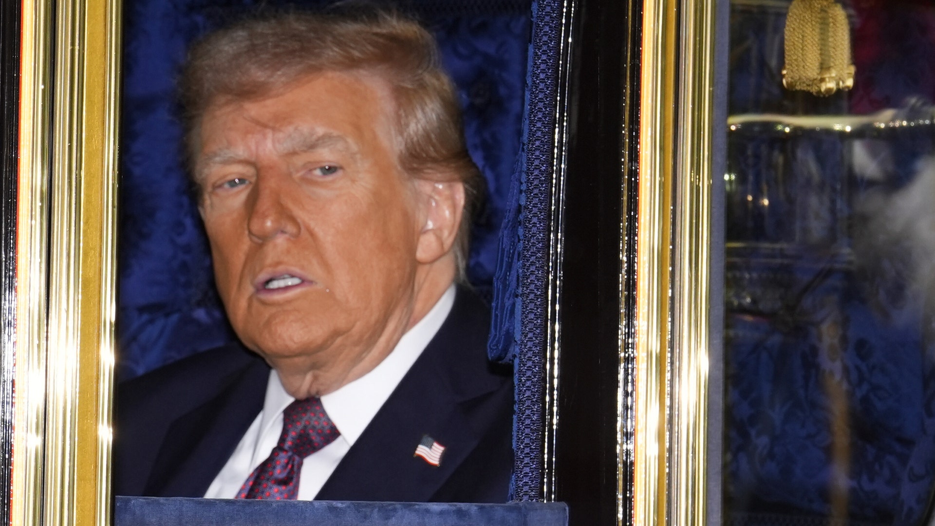 President Donald Trump and King Charles III ride in the carriage procession to Windsor Castle on September 17, 2025.