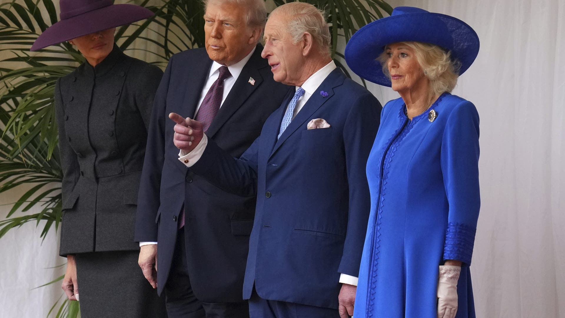 President Donald Trump, King Charles III, Queen Camilla, and Melania Trump wait to review the Guard of Honour at Windsor Castle.