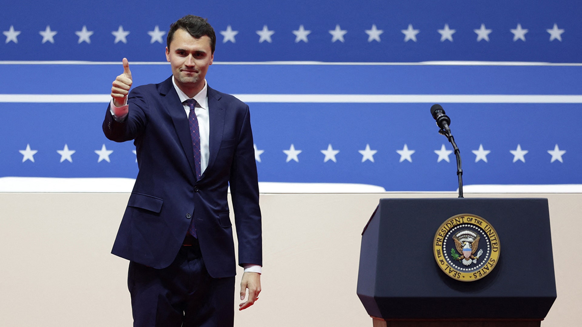 Charlie Kirk gives the thumbs up