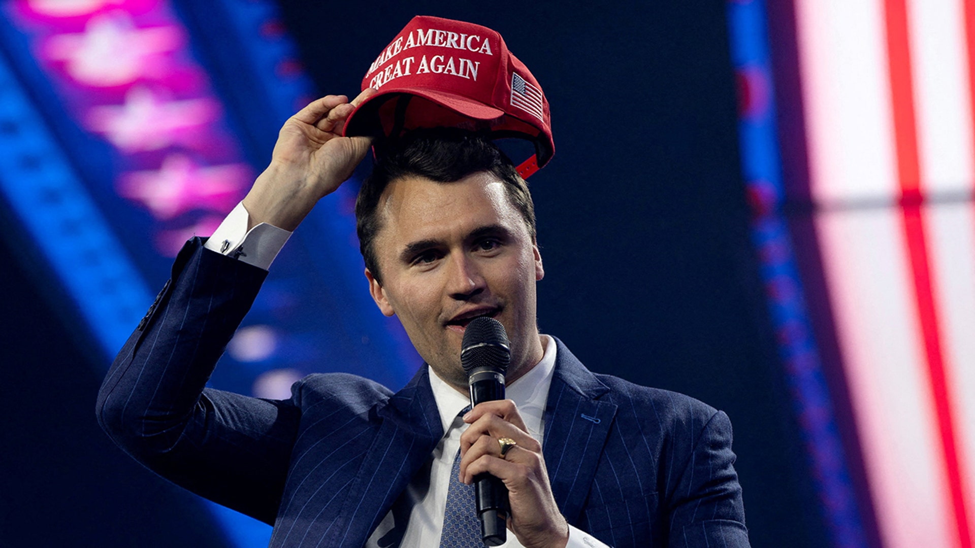 Charlie Kirk with a MAGA hat