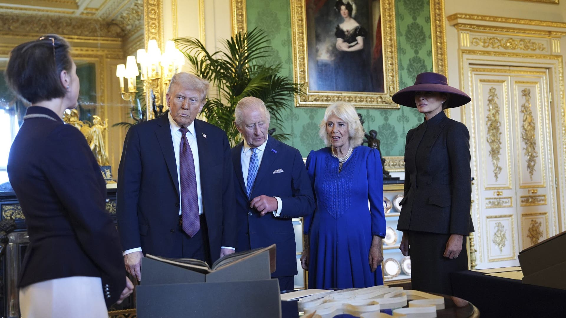 President Donald Trump, first lady Melania Trump, King Charles III, and Queen Camilla view a special display of items from the Royal Collection related to the United States at Windsor Castle