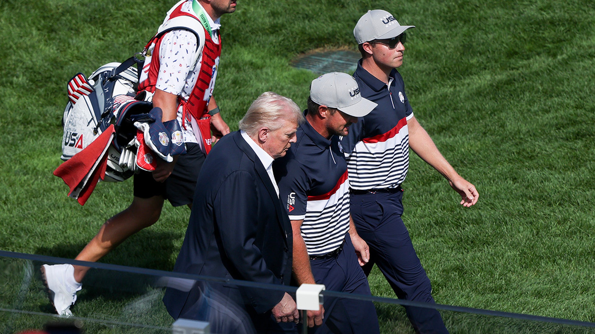 Donald Trump walks with Bryson DeChambeau