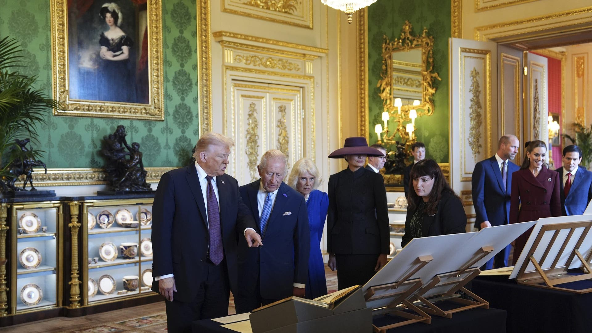 President Donald Trump, first lady Melania Trump, King Charles III, and Queen Camilla view a special exhibit showcasing items from the Royal Collection.