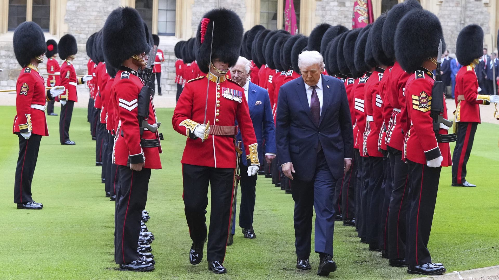 US President Donald Trump and King Charles III review the Guard of Honour at Windsor Castle.