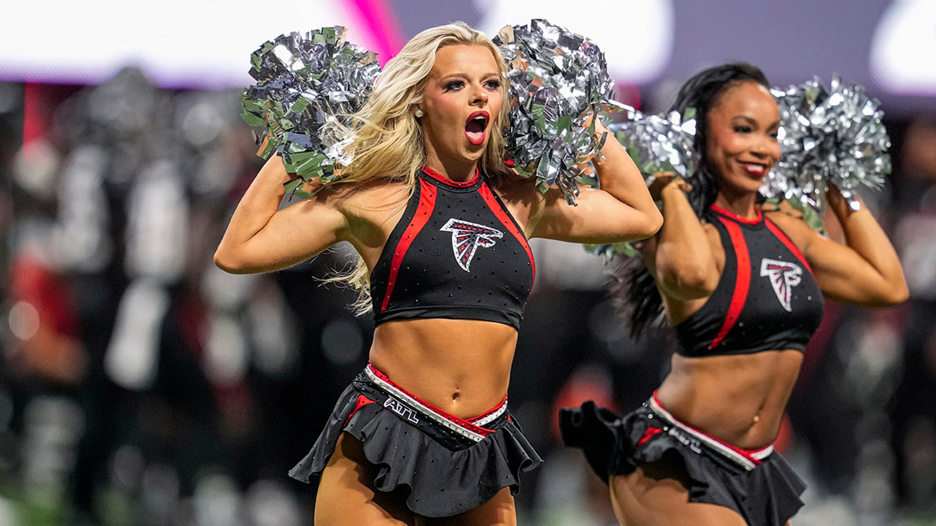 A cheerleader at a Falcons-Lions game