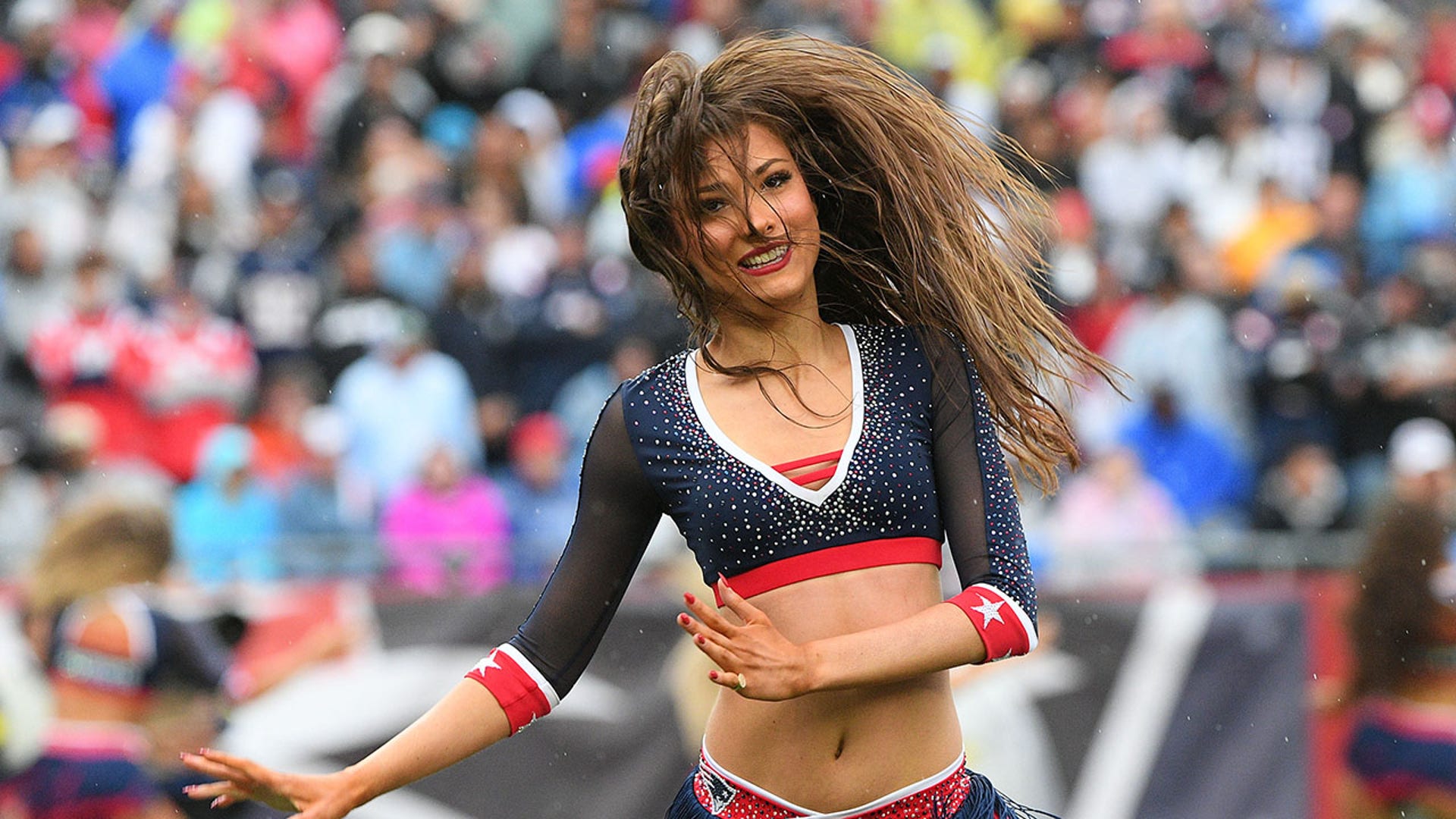 A cheerleader during the Raiders-Patriots game