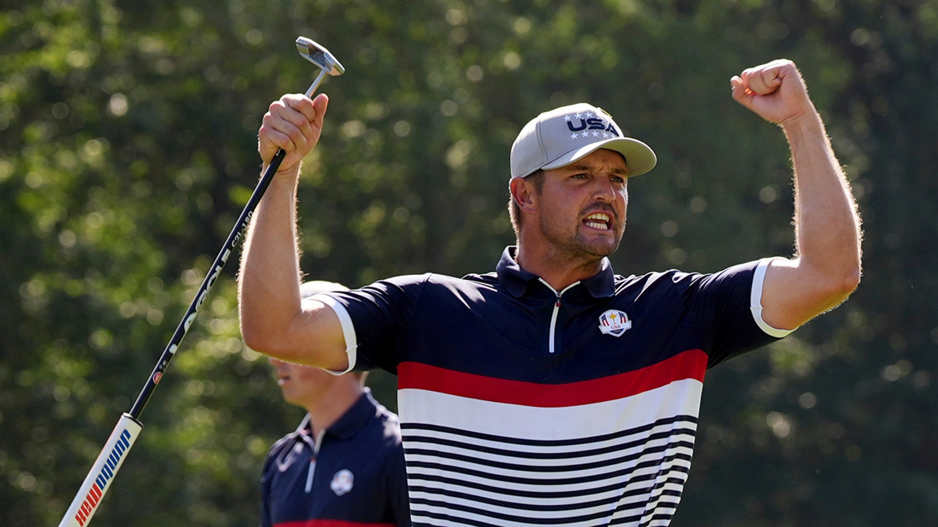 Bryson DeChambeau celebrates