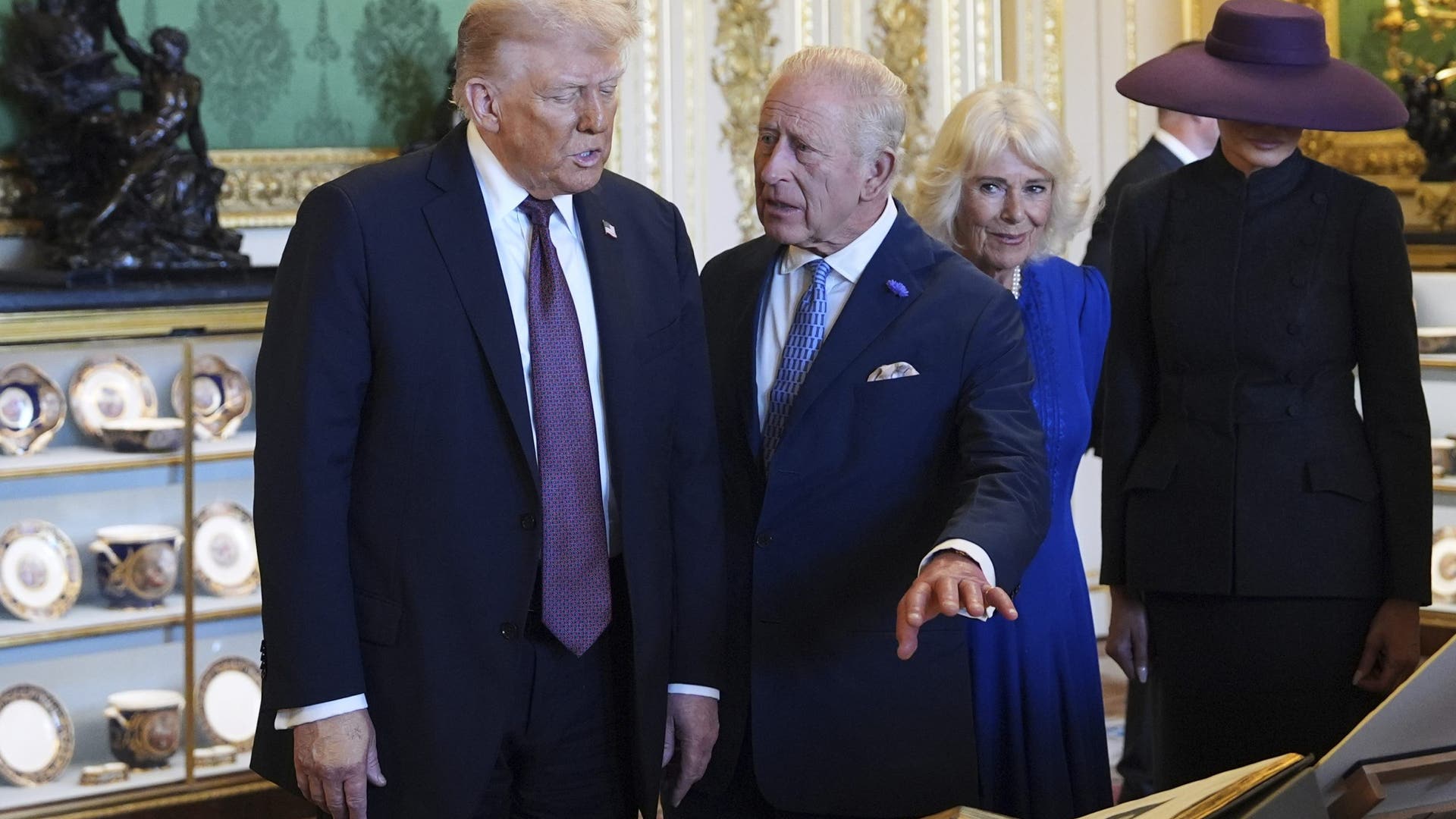 President Donald Trump, first lady Melania Trump, King Charles III, and Queen Camilla view a special display of items from the Royal Collection.