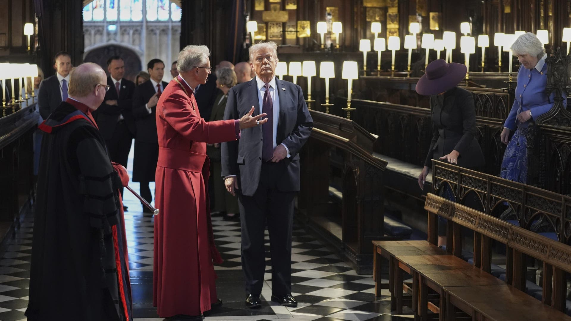 Trump listening to clergy in red robes
