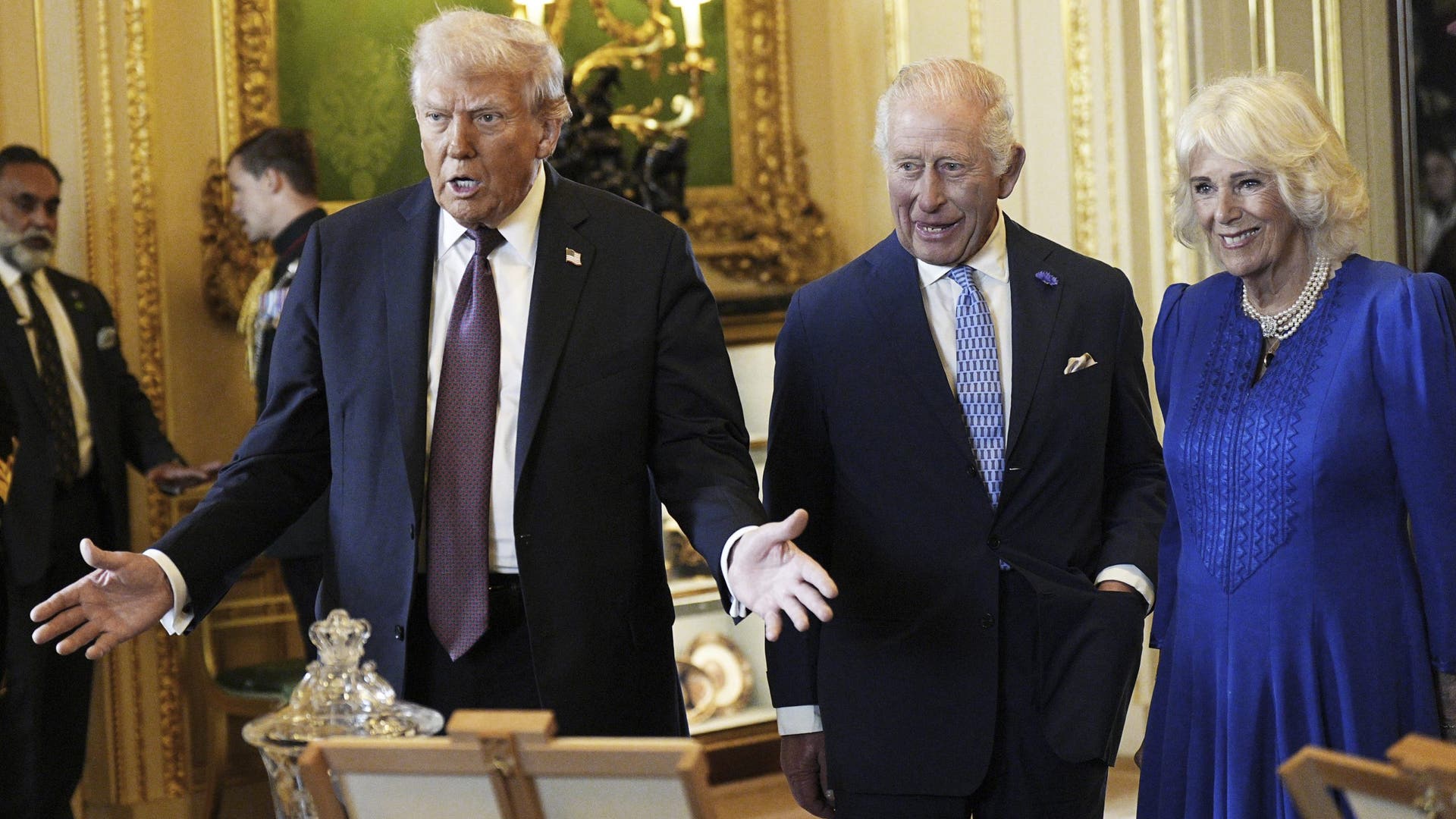President Donald Trump, King Charles III, and Queen Camilla view a display of historical items in the Royal Collection exhibition at Windsor Castle.