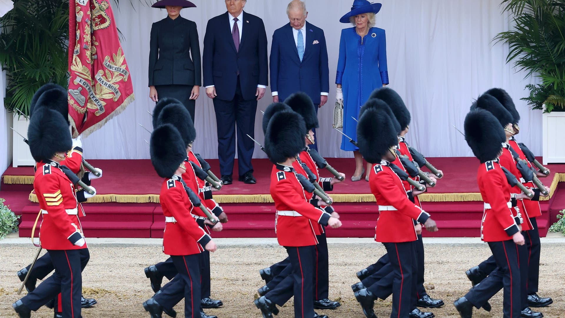 First Lady Melania Trump, President Donald Trump, King Charles III, and Queen Camilla inspect the troops during the ceremonial proceedings at Windsor Castle.