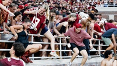 ACC fines Florida State $50,000 under new policy after fans storm field following upset over Alabama