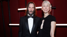 Keanu Reeves' girlfriend sets record straight on wedding rumors with kissing photo