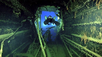 Eerie images show century-old wreck of Titanic's sister ship as divers recover artifacts for first time