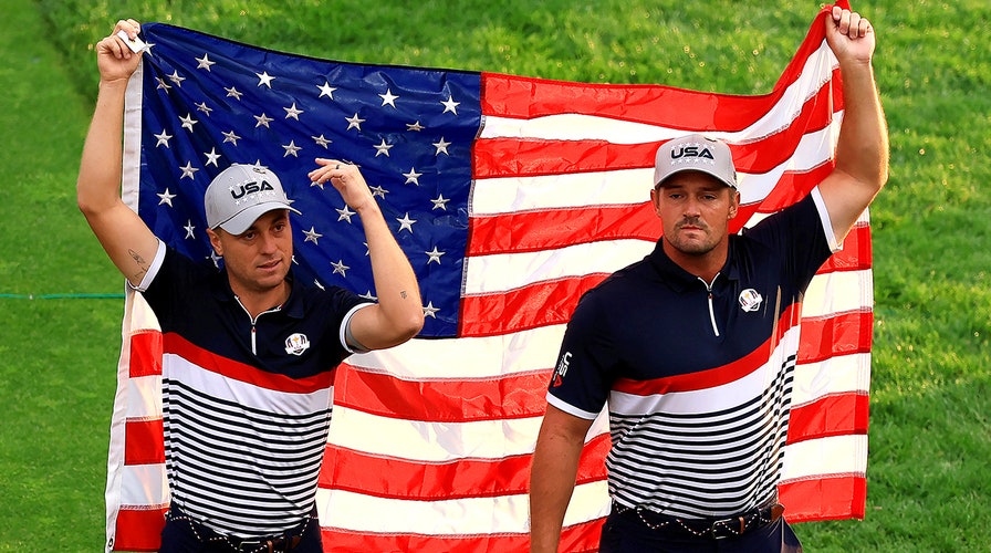 Bryson DeChambeau, Justin Thomas drape USA flag on first tee as fans sing national anthem at Ryder Cup