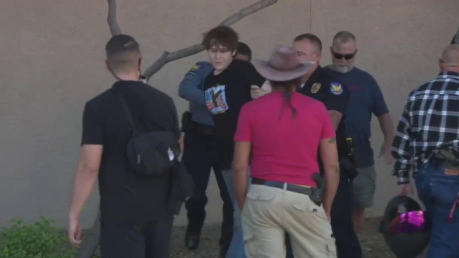 Police arresting Ryder Corral