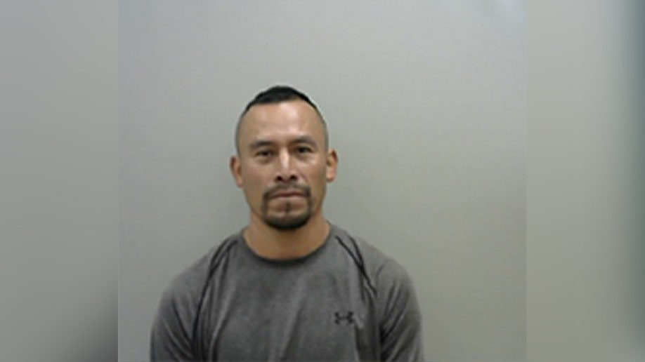 mugshot of Carlos Roman-Berrera