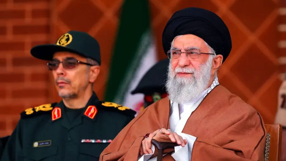 Iran's Supreme Leader, Ayatollah Ali Khamenei looks on