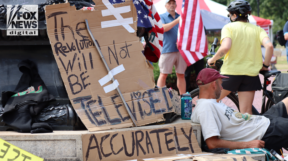 protest sign at union station