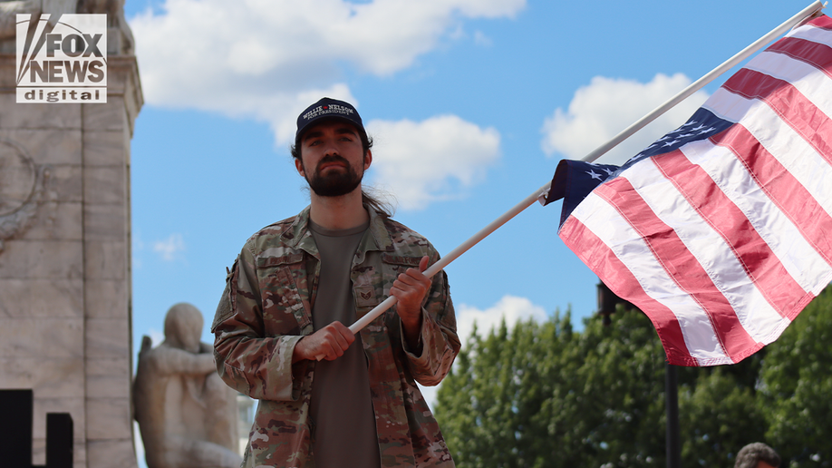 protester flies upside down flag