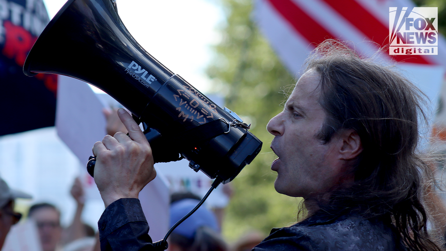 protester with bullhorn at labor dayprotest