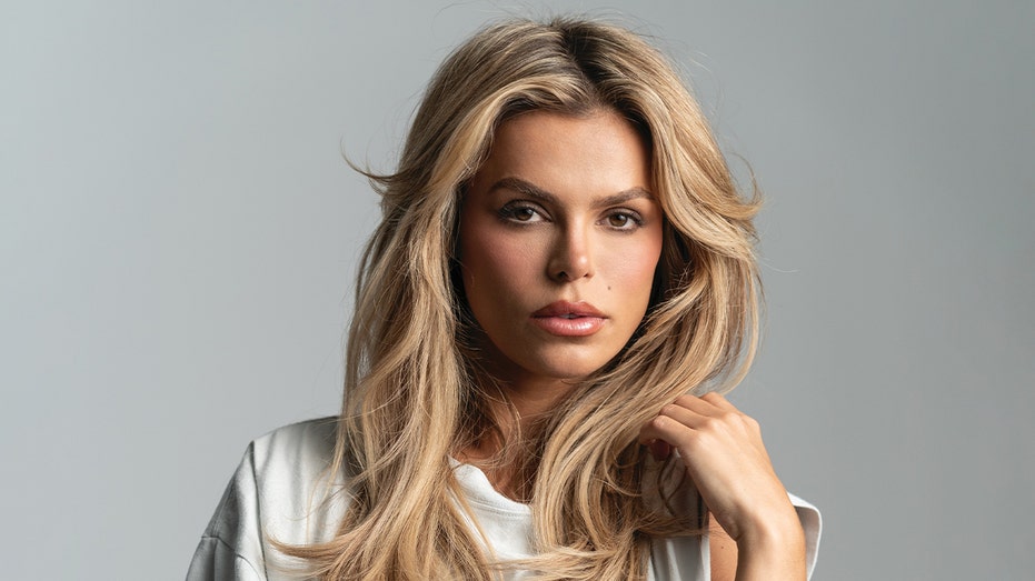 Brooks Nader poses topless while revealing how she left her 'extremely conservative' upbringing for model life