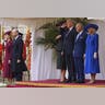 President Donald Trump salutes beside King Charles III and Queen Camilla, with Melania Trump on the left, while Kate and Prince William listen during the national anthem at Windsor Castle on September 17, 2025.
