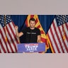 Charlie Kirk with at the podium stumping for President Donald Trump