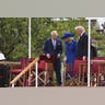King Charles III, Queen Camilla, Donald Trump, and first lady Melania Trump rise from their seats as the ceremony continues.