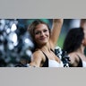 An Eagles cheerleader loooks on