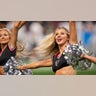A cheerleader mid-cheer