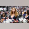A Patriots cheerleader smiles