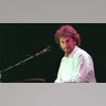 Rick Davies sits at the keyboard during Supertramp show