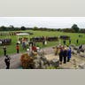 Wide overhead view of Windsor Castle’s ceremonial lawns with marching guards, guests, and royals including Donald Trump.