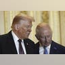 President Donald Trump and King Charles III examine historical items in the Green Drawing Room at Windsor Castle.